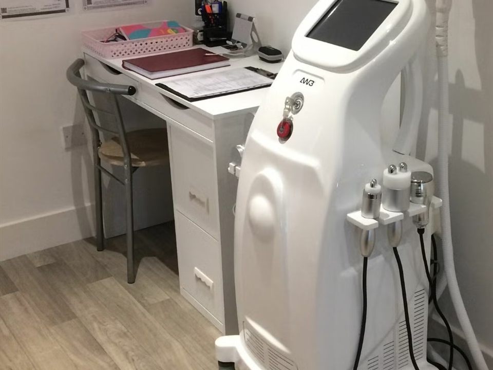 The treatment room at Dingwall Laser Clinic — laser machine and treatment chair